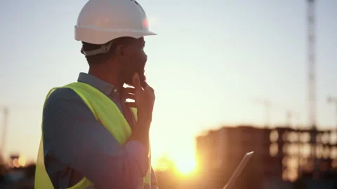 Engineering and development of modern buildings, portrait of african foreman Stock Footage 318709815