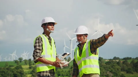 Engineering and Technician Using Drone in windmill farm Video stock 157036510