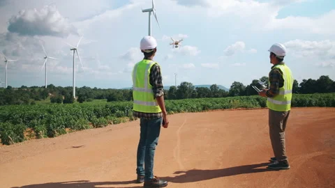 Engineering and Technician Using Drone in windmill farm Видео 157037051