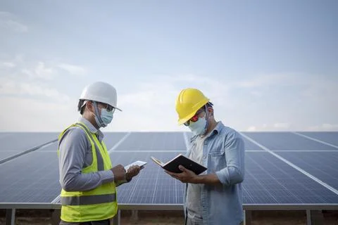Engineering and technicians to power solar panel renewable power plants in Th Stock Photos