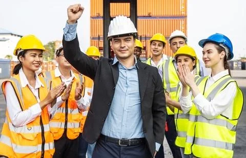 Engineering and worker team congratulated success by applaud their leader Stock Photos