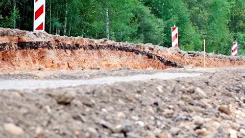 The engineering behind building modern roads, gravel path under construction Stock Footage 332590972