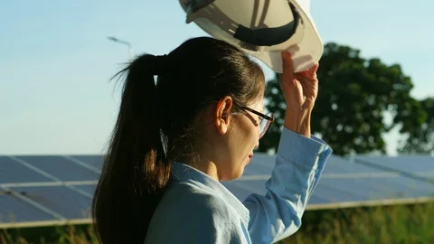 Engineering checking Solar cell Farm, standing near sun panels. Stock Footage 119074092