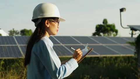 Engineering checking Solar cell Farm, standing near sun panels. Stock Footage 119074100