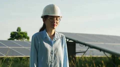 Engineering checking Solar cell Farm, standing near sun panels. Stock Footage 119074364