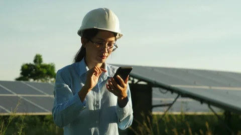 Engineering checking Solar cell Farm, standing near sun panels. Stock Footage 119074452