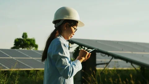 Engineering checking Solar cell Farm, standing near sun panels. Stock Footage 119074600
