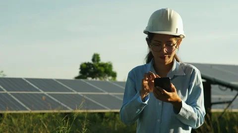 Engineering checking Solar cell Farm, standing near sun panels. Stock Footage 119074660