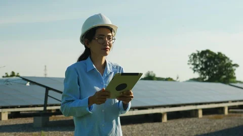 Engineering checking Solar cell Farm, standing near sun panels. Stock Footage 119074680