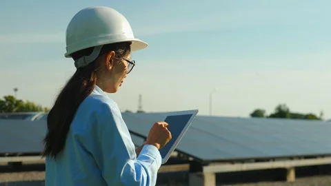 Engineering checking Solar cell Farm, standing near sun panels. Stock Footage 119074874