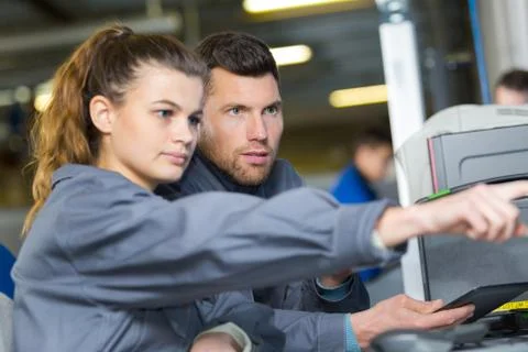 Engineering colleagues solving a problem Stock Photos