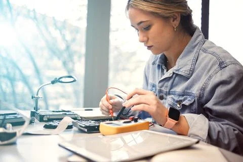 Engineering, college student and electronics with woman learning for electrical Stock Photos