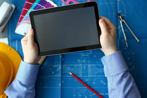 Engineering college student holds tablet Stock Photos