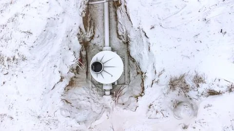 Engineering communications in winter top view, concept of heat supply accident Stock Photos