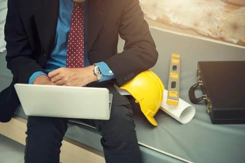 Engineering concept. Businessman working with computer laptop in room with he Stock Photos