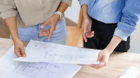 Engineering construction concept, Two female engineers checking blueprint o.. Stock-Fotos
