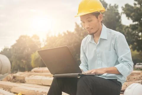 Engineering construction holding computer notebook inspection work at estate  Foto stock