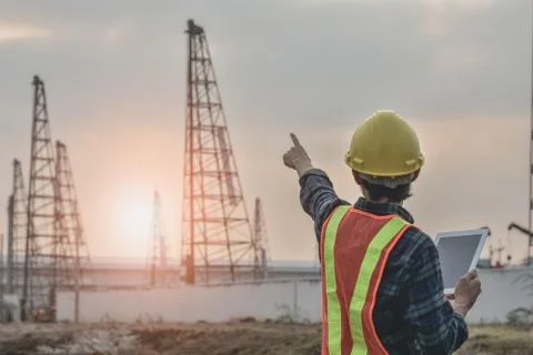 Engineering construction  holding tablet Posting cranes for pile construction Stock Photos