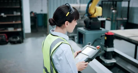 Engineering, controller and manufacturing with woman in workshop for industrial Stock Footage 331571607