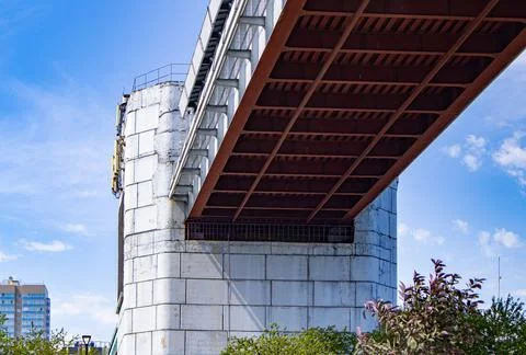 Engineering design of the metro bridge with concrete supports, bottom view. P Stock Photos