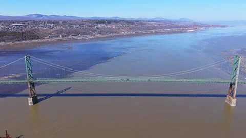 Engineering design of suspension bridge connecting land areas Stock Footage 333216558