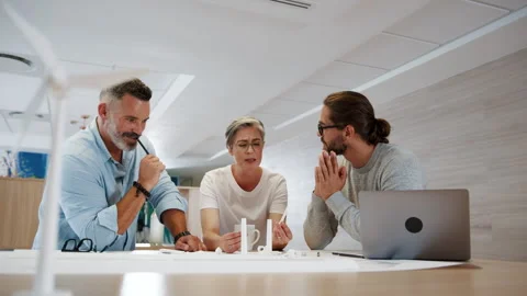 Engineering experts discussing a windmil... | Stock Video | Pond5