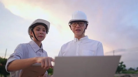 An engineering foreman teaching trainee in construction site area Stock Footage 157067784
