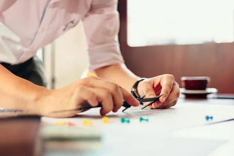 Engineering hands hold vernier caliper working and checking drawing blue pr.. Stock Photos