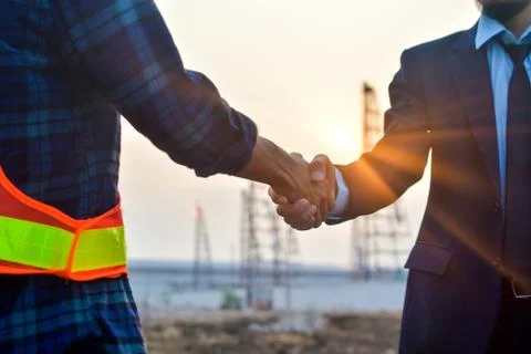 Engineering hands shake at work place building construction estate project su Stock-Fotos