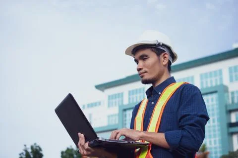 Engineering helmet and Construction of building house or skyscraper Stock Photos