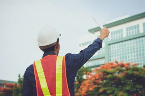 Engineering helmet and Construction of building house or skyscraper Stock Photos