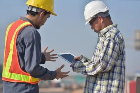 Engineering holding tablet work on road construction Stock Photos