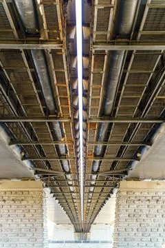 Engineering infrastructure of metal under the bridge Stock Photos