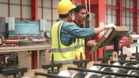 Engineering is on the job training apprentices of metal sheet roof ironing Stock Footage 176087909