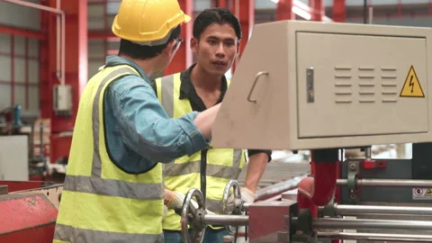 Engineering is on the job training apprentices of metal sheet roof ironing Stock Footage 186336406