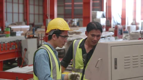 Engineering is on the job training apprentices of metal sheet roof ironing Stock Footage 193346474