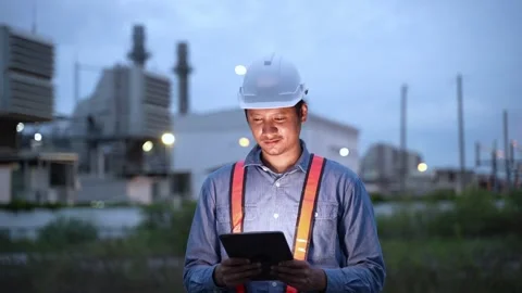 Engineering man working with digital tablet on power plant working site at night 動画素材 279505367