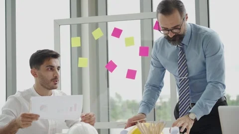 Engineering or architect man working with manager in office, slow-motion Stock Footage 139797826
