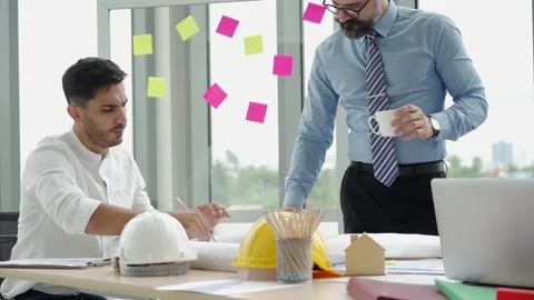 Engineering or architect man working with manager in office, slow-motion Stock Footage 139797895