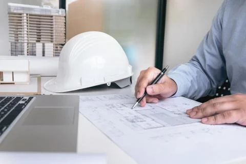 Engineering or Creative architect in construction project, Engineers hands wo Stock Photos