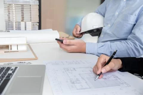 Engineering or Creative architect in construction project, Engineers hands wo Stock Photos