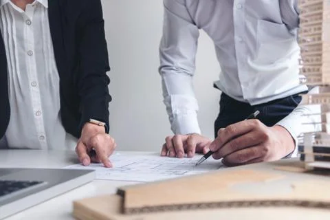 Engineering or Creative architect in construction project, Engineers hands wo Stock Photos