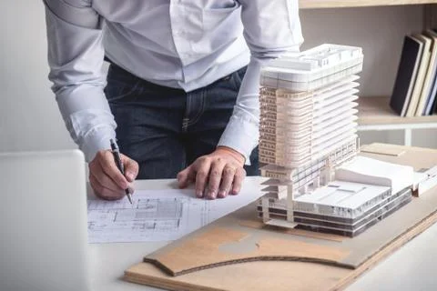 Engineering or Creative architect in construction project, Engineers hands wo Stock Photos