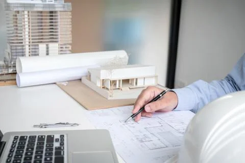 Engineering or Creative architect in construction project, Engineers hands wo Stock Photos