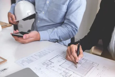 Engineering or Creative architect in construction project, Engineers hands wo Stock Photos