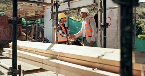 Engineering, people and handshake at construction site with success, scaffolding Stock Footage 336224138