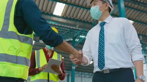 Engineering people are wearing face mask happy in modern factory , industrial 動画素材 158173656