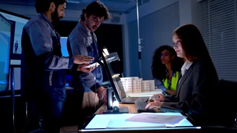 Engineering professionals reviewing architectural plans Stock Footage 340460796