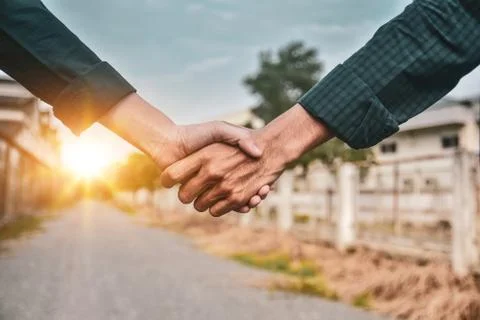 Engineering shake hand sunlight background Stock Photos