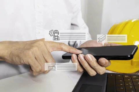 Engineering staff use mobile phones to check the work and send the work dat.. Stock Illustration